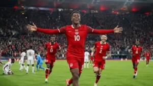 Canada vs Qatar FIFA World Cup 2026 Match Update showing Jonathan David celebrating after scoring during Canada's historic 6-0 victory over Qatar